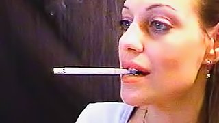 She smokes close up on webcam