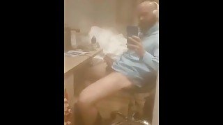 Bearded guy in blue shirt with big dick masturbating