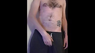 Guy strips to show off big cock