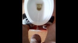 Pissing in toilet