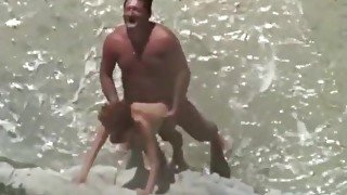 Sex on the beach. Mature couple. She s in love with