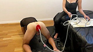 XXXBAT Mistress plays with Rubberfashion enema plug and her slave