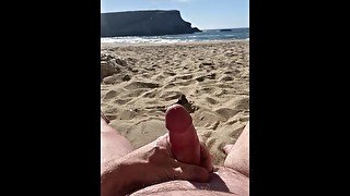 A nudist orgasms at the beach