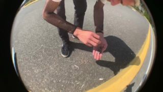 Two Young Skater boys ride each other’s wood in parking lot