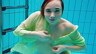 Long haired redhead Russian girl totally looks like mermaid