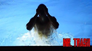 Athletic teen boy swims at nigth without his mask in his new pool.