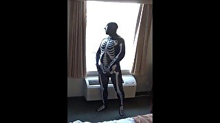 skeleton jerking off at hotel window watching truck drivers get ready for work