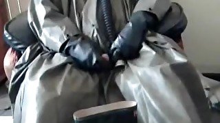 Wanking in tatty rubber poncho and even tattier rubber waders.