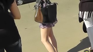 Cute leggy beauty being upskirted