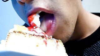 Eating cake with his mouth