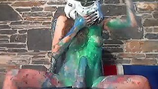 This webcam girl is covered in paint as she rides her dildo like crazy