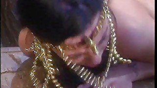 Sexy short haired brunette in Cleopatra outfit takes cock, then a huge cumshot