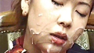 Japanese girl gets messy in bukkake