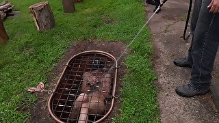 Two shabby looking hussies get locked in metal hatch and poured with cold water