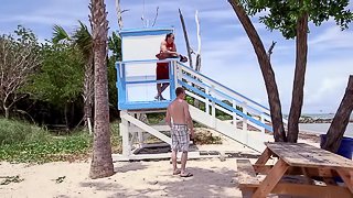 Two gay lifeguards strip down and fuck hard on the beach