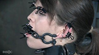 Blossom gets chained and her tits and mouth clamped and abused