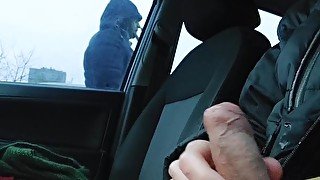 Horny teen twink wanks off his cock in the car at the parking lot and flashing dick to the public