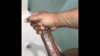 Stroking my big black dick while girlfriend  in room