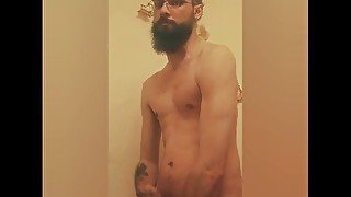 Muscular Bearded guy jerks off