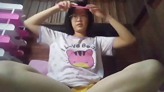 Cute Asian girl shows pussy and plays