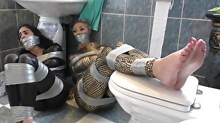 Two Girls In Catsuit Duct Taped And Gagged