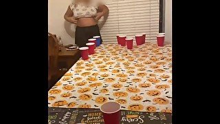 Playing pong and she flashes to distract