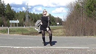 Business lady flashing on the road