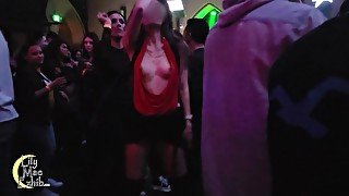 Tits out on the crowded dance floor!