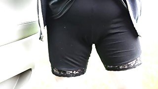 Desperate leggings pee along the road