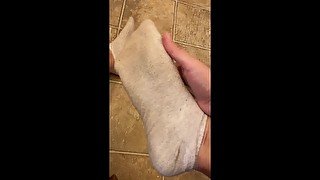 Using my dirty socks to wipe my sweaty feet