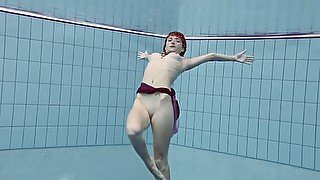 Smoking hot Russian redhead in the pool