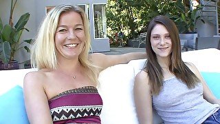 Blonde lesbian MILF fucks younger girl on the couch