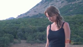 Busty tanned babe masturbates in nature solo