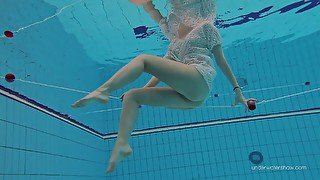 Adorable babe Katy Soroka is stripping under the water