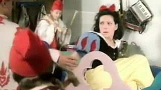 Snow White plays with a thick long candle for her seven dwarves