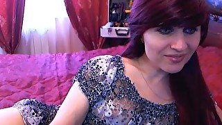 Redhead mature has fun on the webcam. Foot game