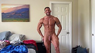 Muscle Jock Flexing And Stroking Cock While Folding Laundry