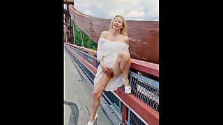 Hot MILF in public fingering an orgasm on the bridge over the busy highway