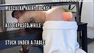 Muscular hairy jock ass exposed while stuck under the table