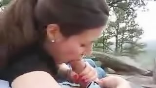 Stunning brunette gives a nice outdoors blowjob