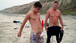 Mutual cumshots on gay couples faces after a fun day at the beach