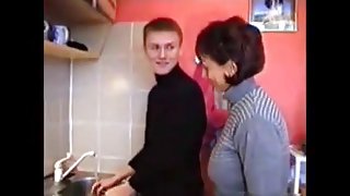 Russian mom Amalia with her boy in kitchen