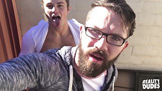 Nerdy gay hipster gets down on his knees to suck his friends dick