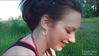 Blowjob in a grassy field from cute GF