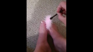 Rubbing my feet with feathers