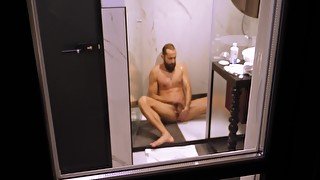 Free Premium Video Mature Dude Filmed From Outside While Taking A Shower And Jerking Off His Hard Cock