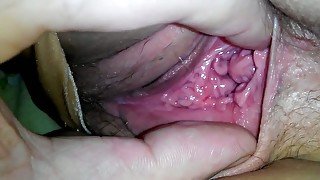 Stretching my wife's pussy lips and showing her privates closeup