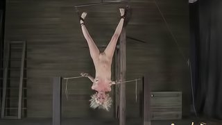 Blonde called Cherry tortured while hanging upside down in the dungeon