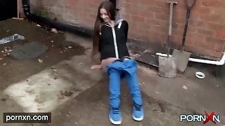 Pretty long haired girl pees on the streets of Britain