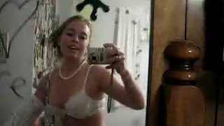 Solo scene with a nasty teen stripping in front of a mirror